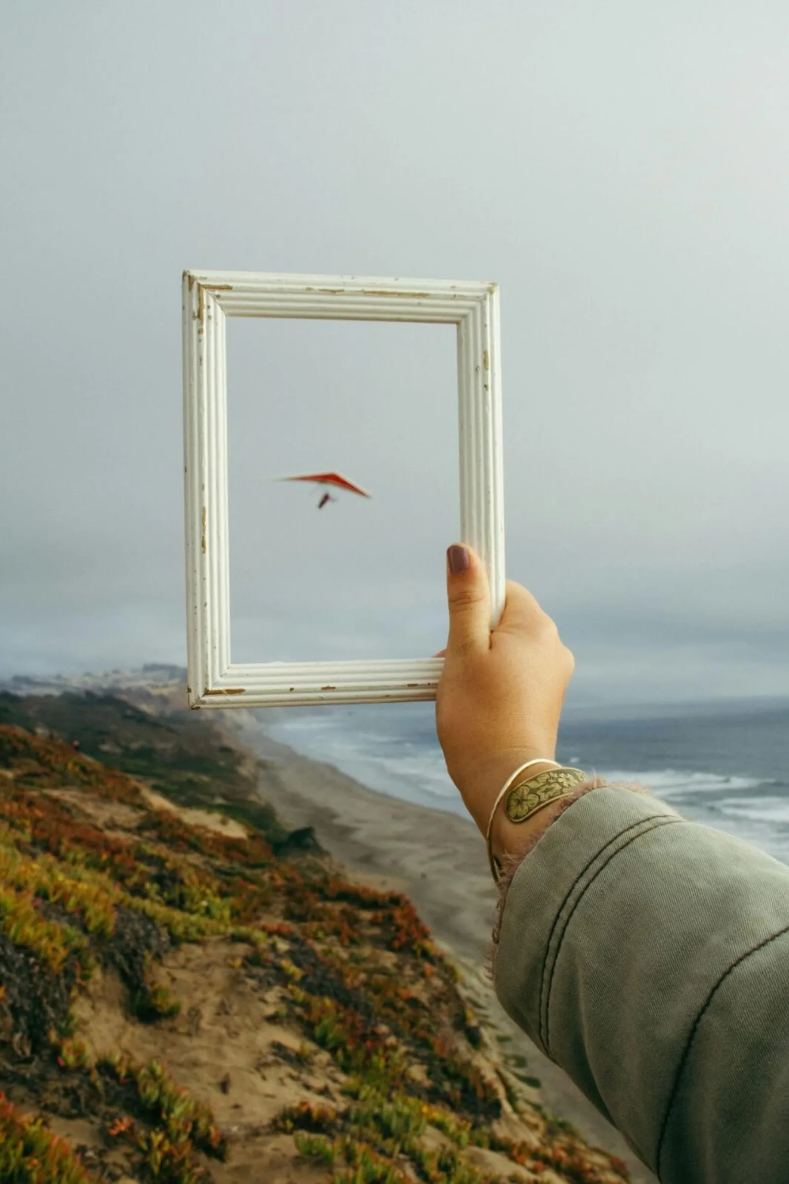 Looking outside a picture frame at the bigger picture of something.