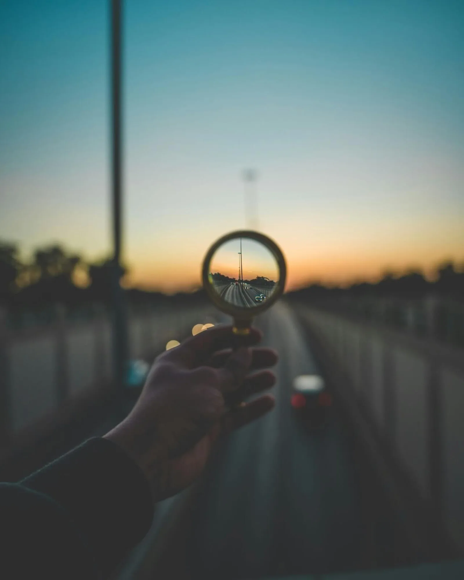 Looking through a magnifying glass, signifying looking at a goal.
