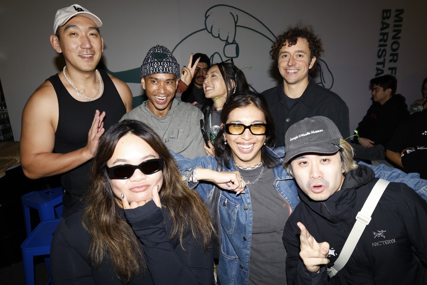Friends smiling together at a branded pop-up event as part of an Instagram storytelling campaign
