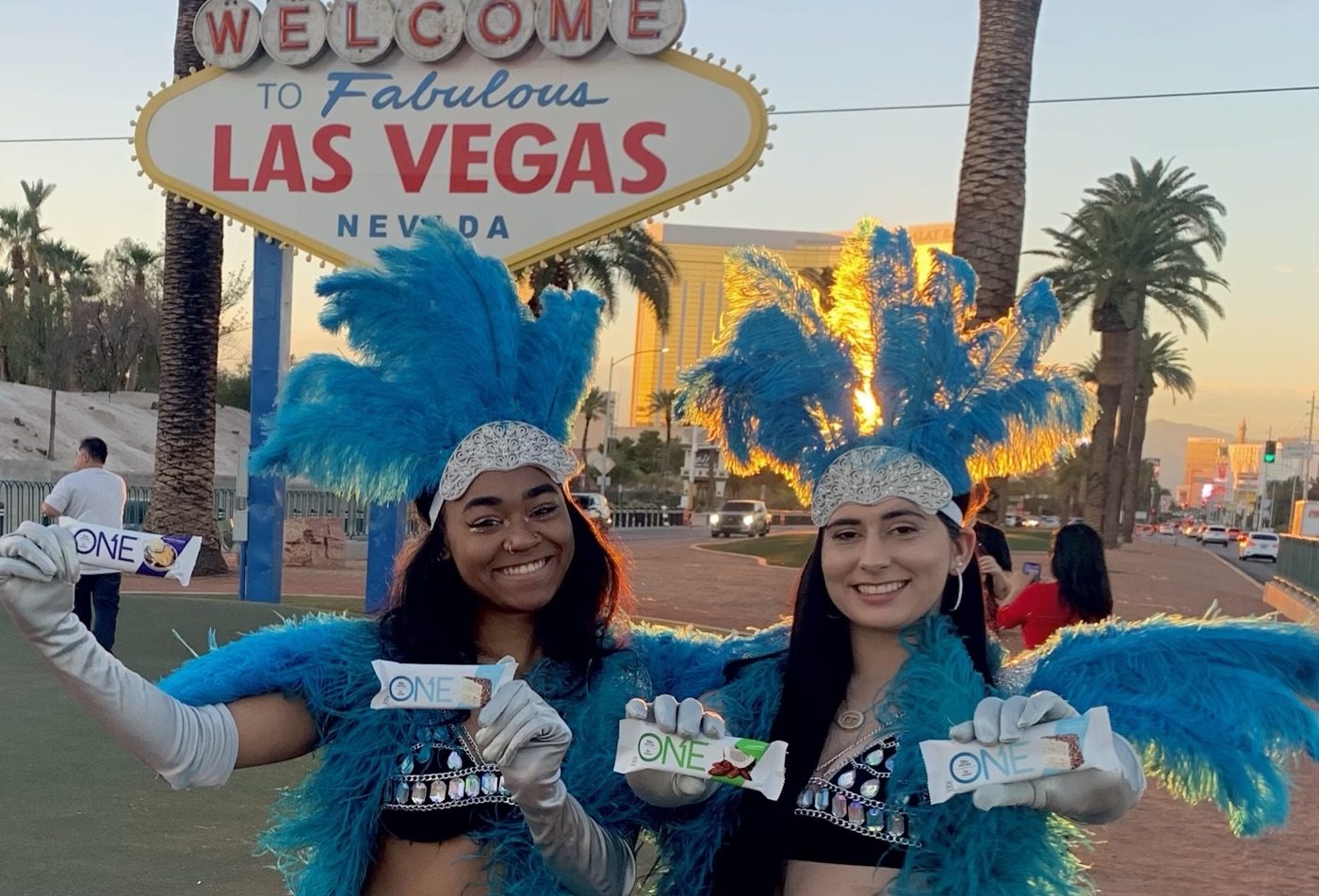 Costumed brand ambassadors sampling ONE protein bars in Las Vegas as part of a street team marketing activation