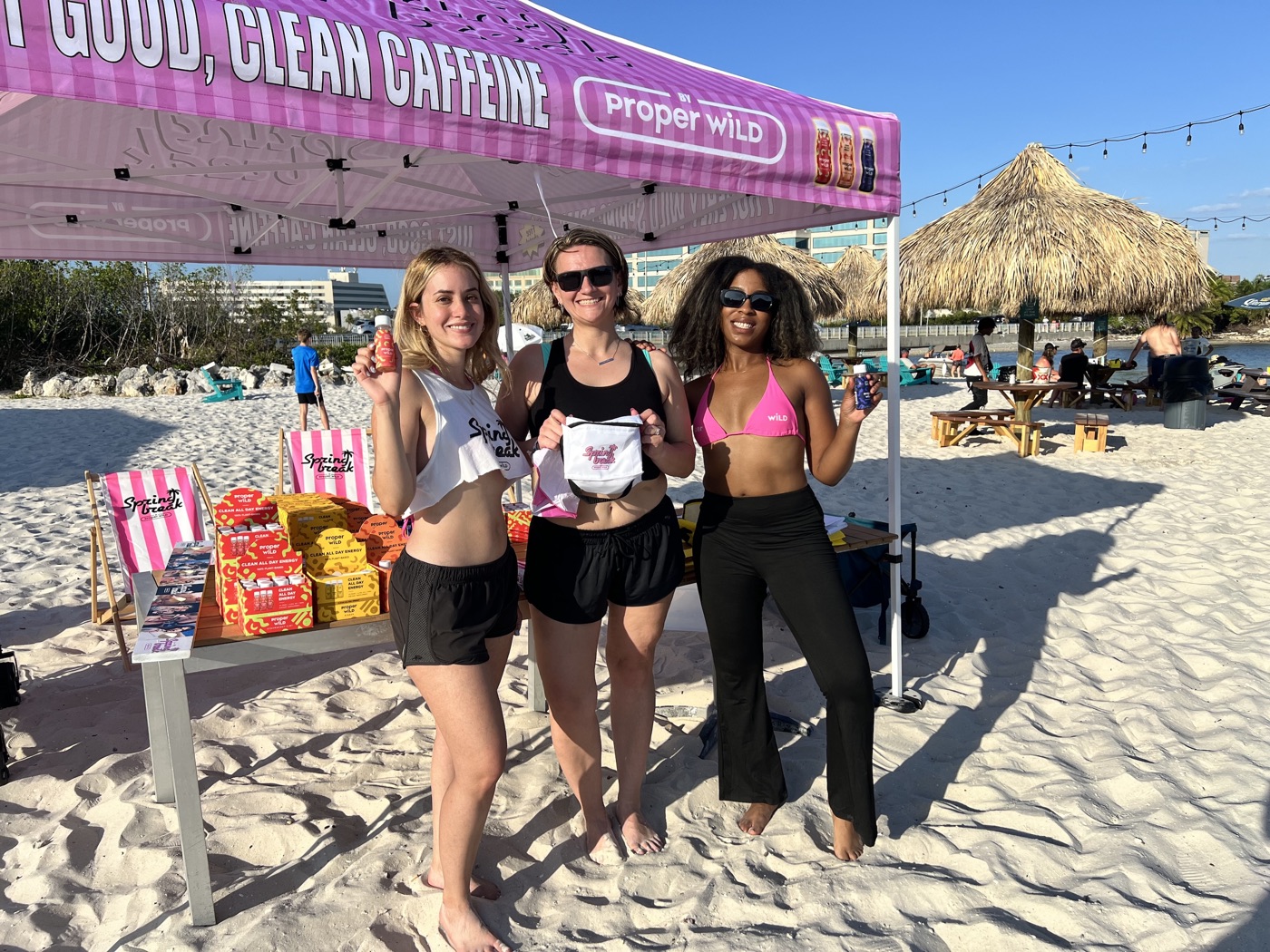 A Little Bird street team sampling Proper Wild energy shots on the beach during a multi-market CPG sampling tour