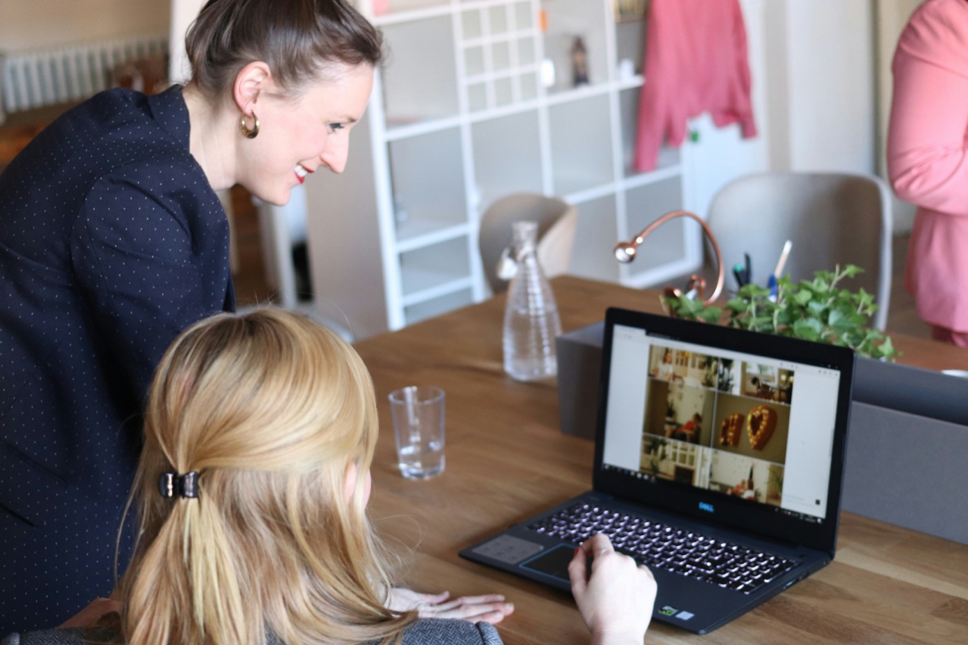 Marketing team reviewing campaign results and retail sell-through data on a laptop